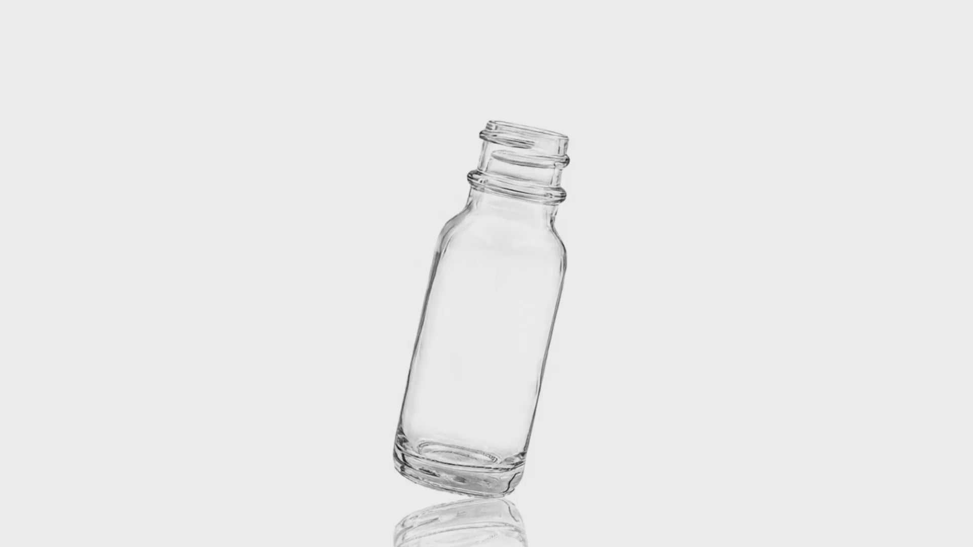 Load video: 1/2 Oz Clear Glass Boston Round Bottle 18-400