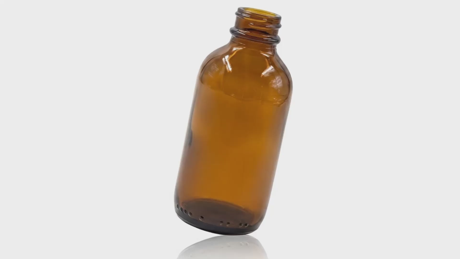 Load video: 100 ml Amber Glass Metric Round Bottle 24-400