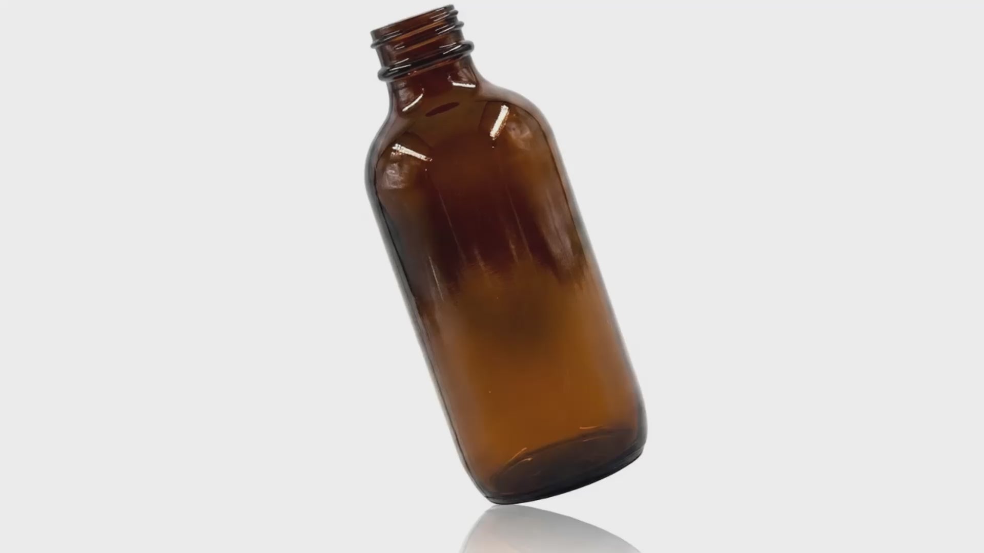 Charger la vidéo : Bouteille Winchester ronde en verre ambré de 4 oz 24-400