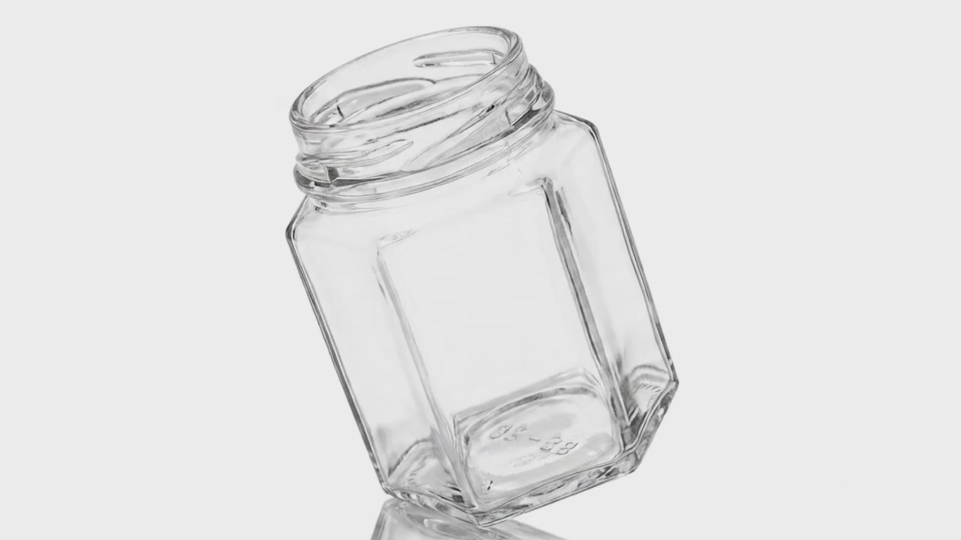 Load video: 9 oz Clear Glass Hexagon Jar 63 mm Twist / Lug