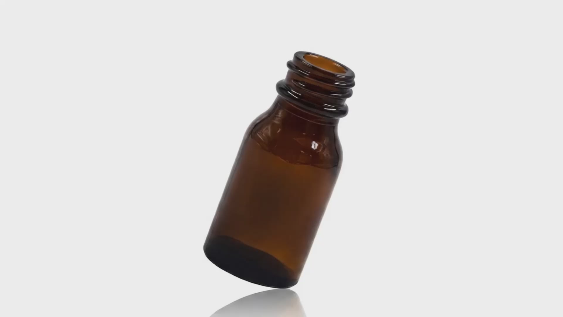 Load video: 15 ml Amber Glass Winchester Round Bottle 20-400