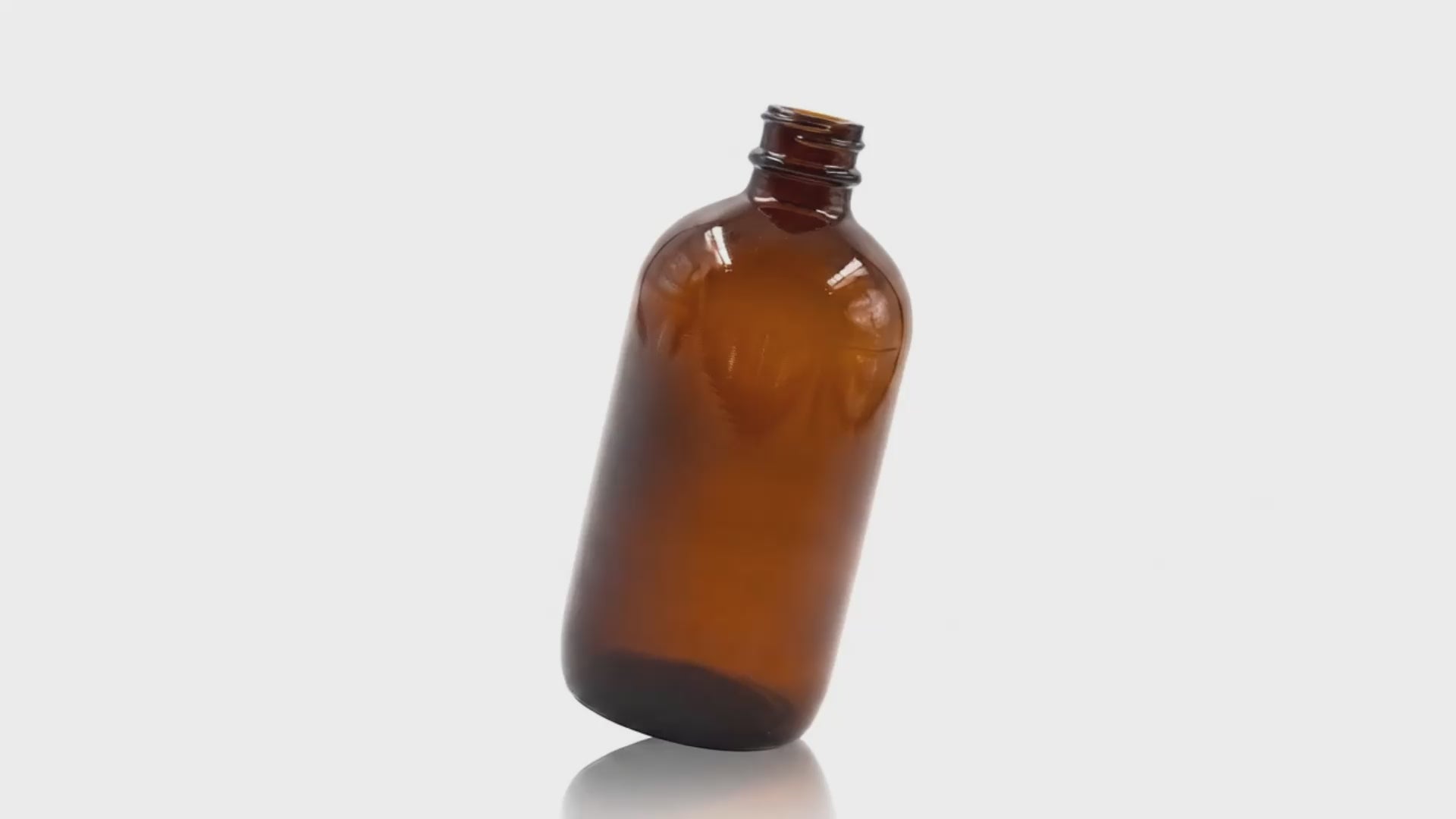 Load video: 250 ml Amber Glass Metric Round Bottle 24-400