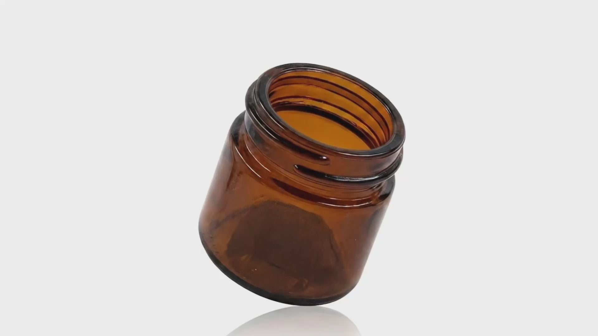 Load video: 25 ml Amber Glass Round Ointment Jar 38-400